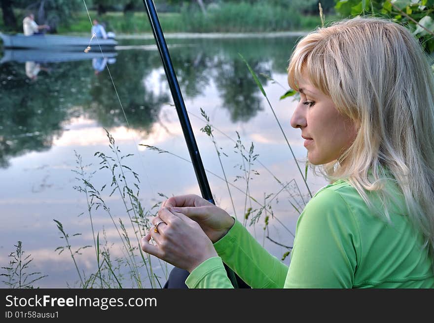 The girl fishes on the Dnieper river. The girl fishes on the Dnieper river