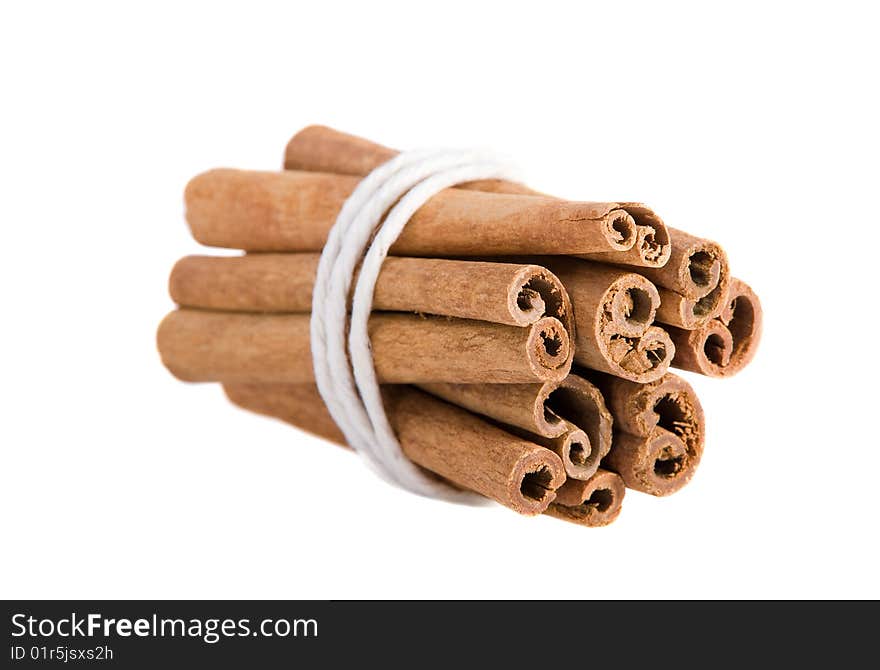 Bundle of cinnamon sticks on the white background