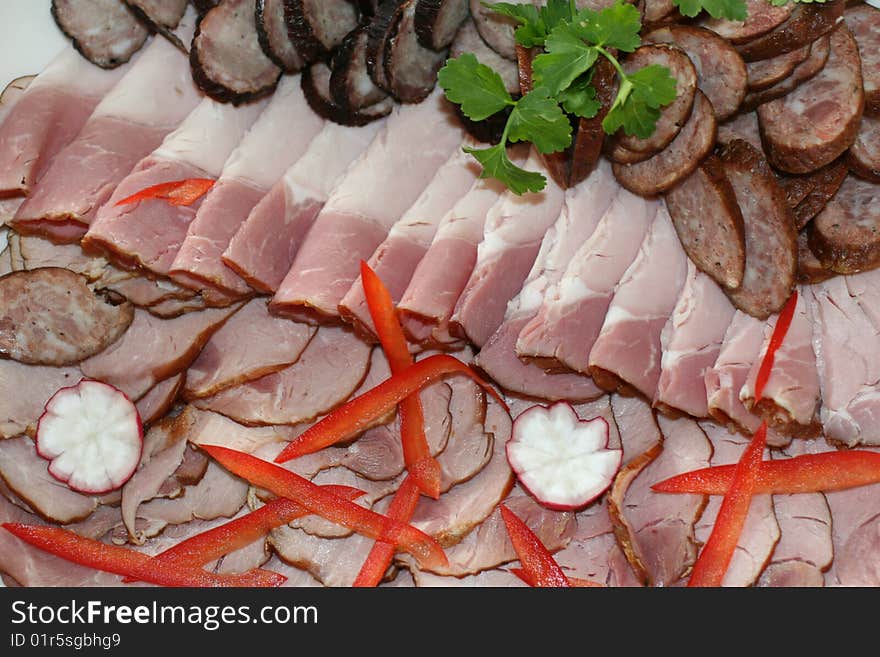 Cold meat decorated with pepper, prepared for easter breakfast. Cold meat decorated with pepper, prepared for easter breakfast