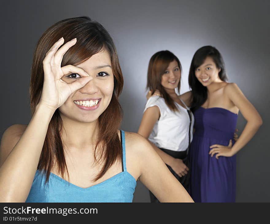 Three Beautiful Young Asian Women In Dresses. Three Beautiful Young Asian Women In Dresses.