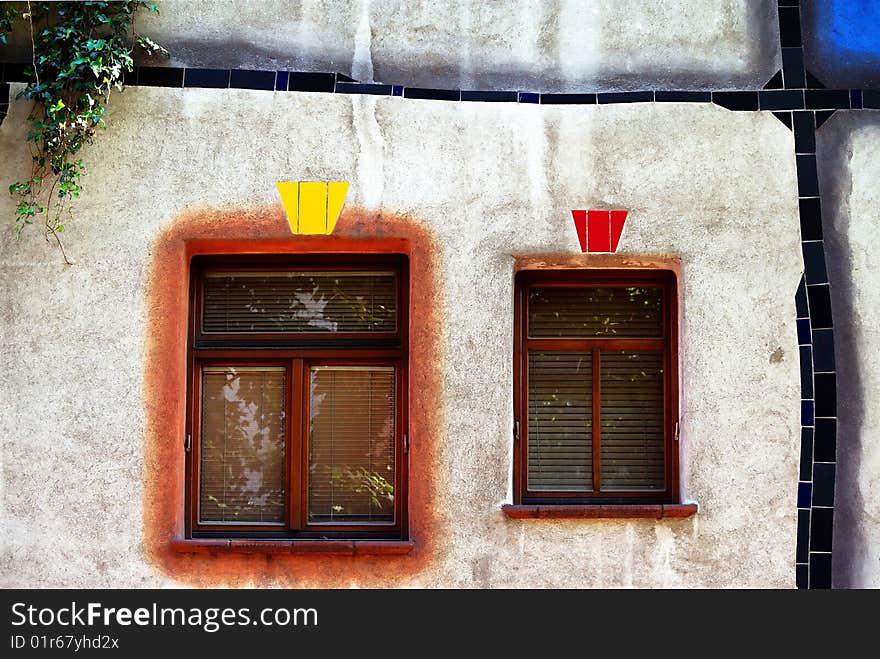 Two Windows In Organic Facade