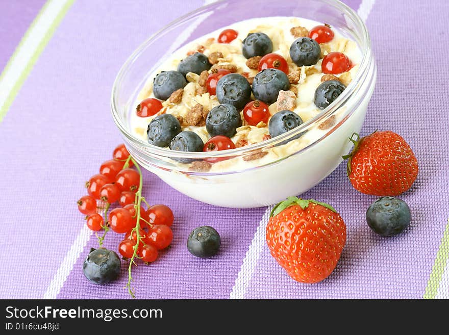 Bowl of corn flakes with fresh fruits and jogurt. Bowl of corn flakes with fresh fruits and jogurt