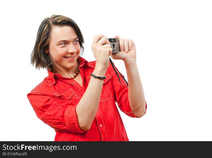 Young guy photographs something. Isolated over white in studio.