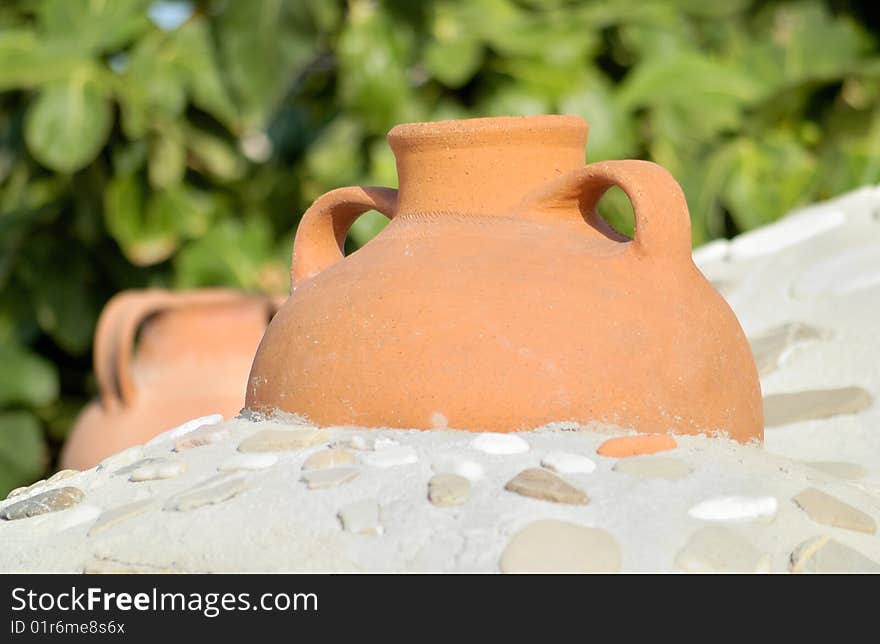 Ewers imbedded onto a stove's roof against a green background. Ewers imbedded onto a stove's roof against a green background.