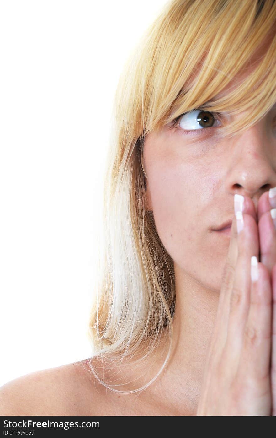 Young blond woman is praying