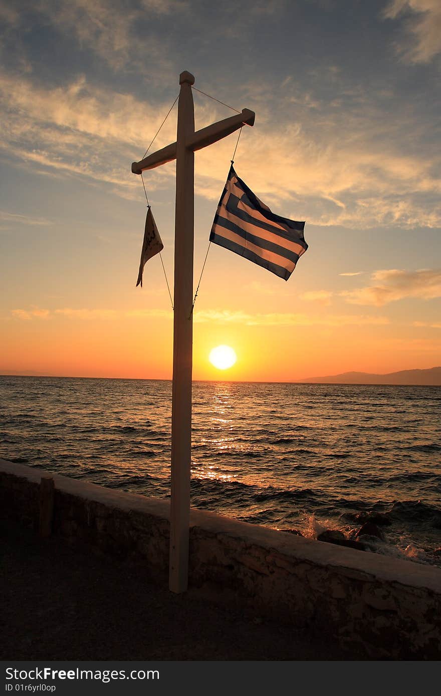 Greece flag under sunset