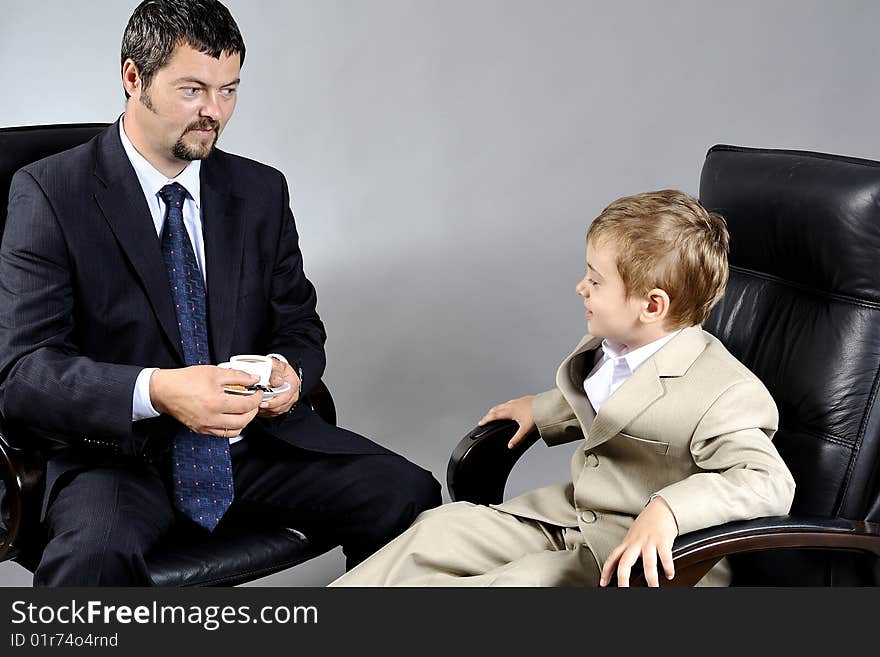 Man and boy discussing important problems about the future. Man and boy discussing important problems about the future