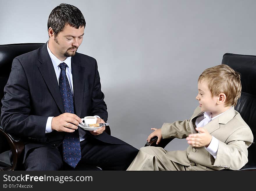 Man and boy discussing important problems about the future. Man and boy discussing important problems about the future