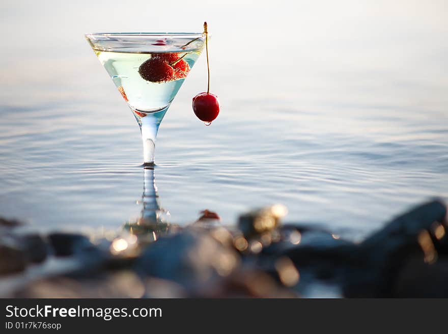 Image of  martini glass  with cherry in water