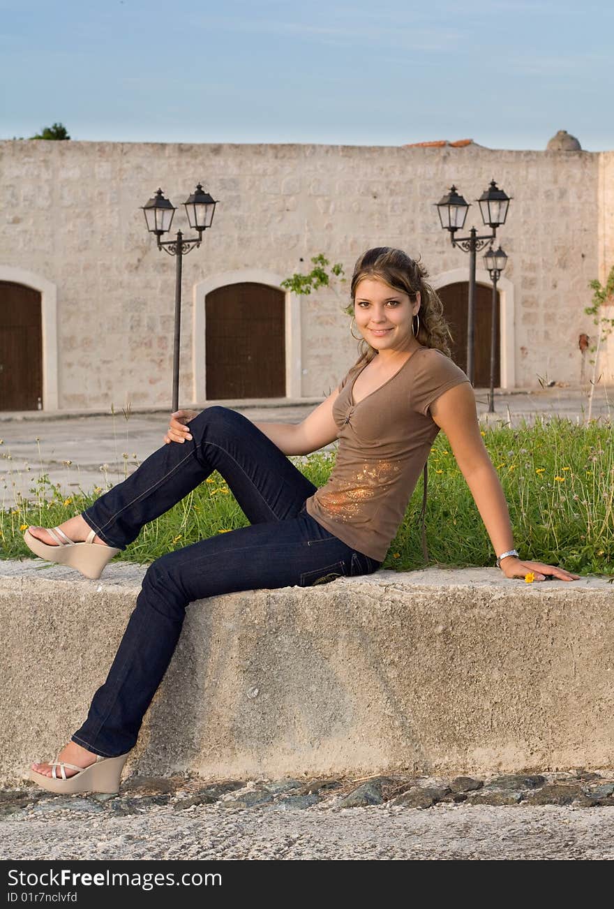 Girl With Blue Jeans Sitting And Relaxing