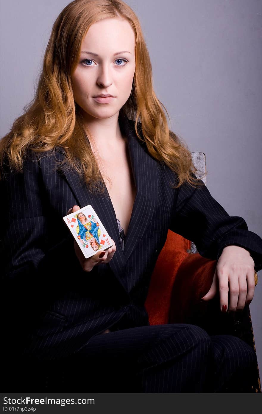 Young woman with playing card. Young woman with playing card