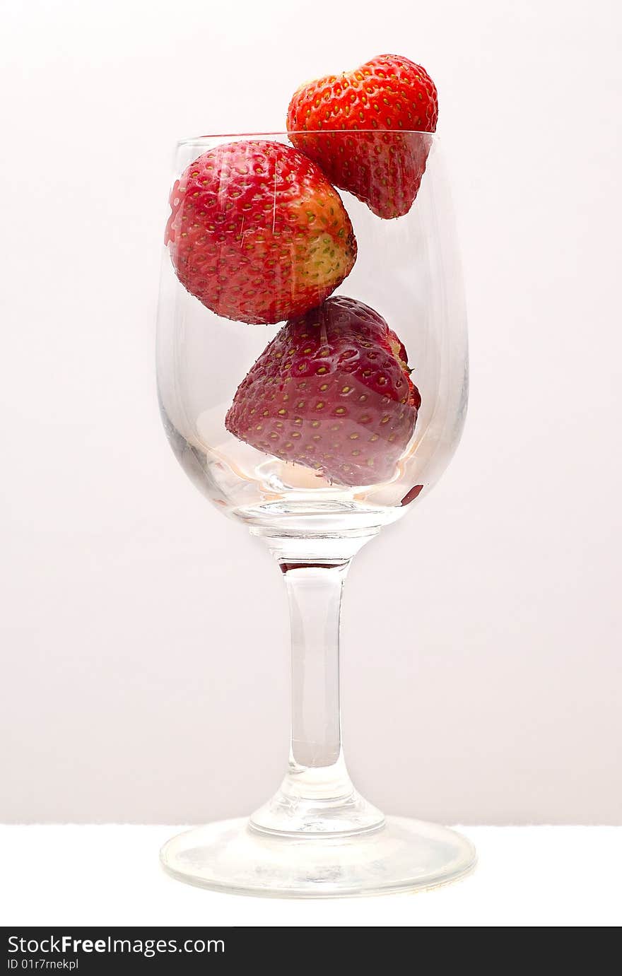 Three Strawberries In A Glass