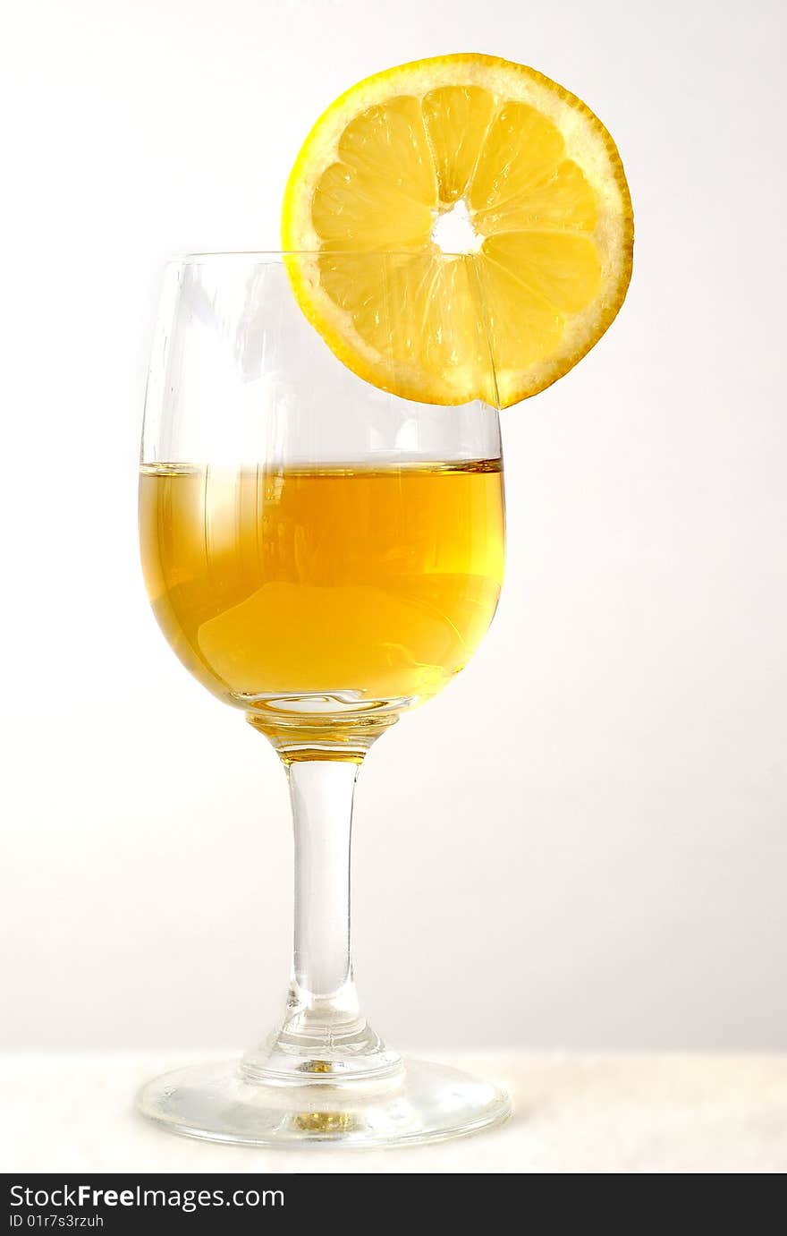 The drink in the glass with an orange