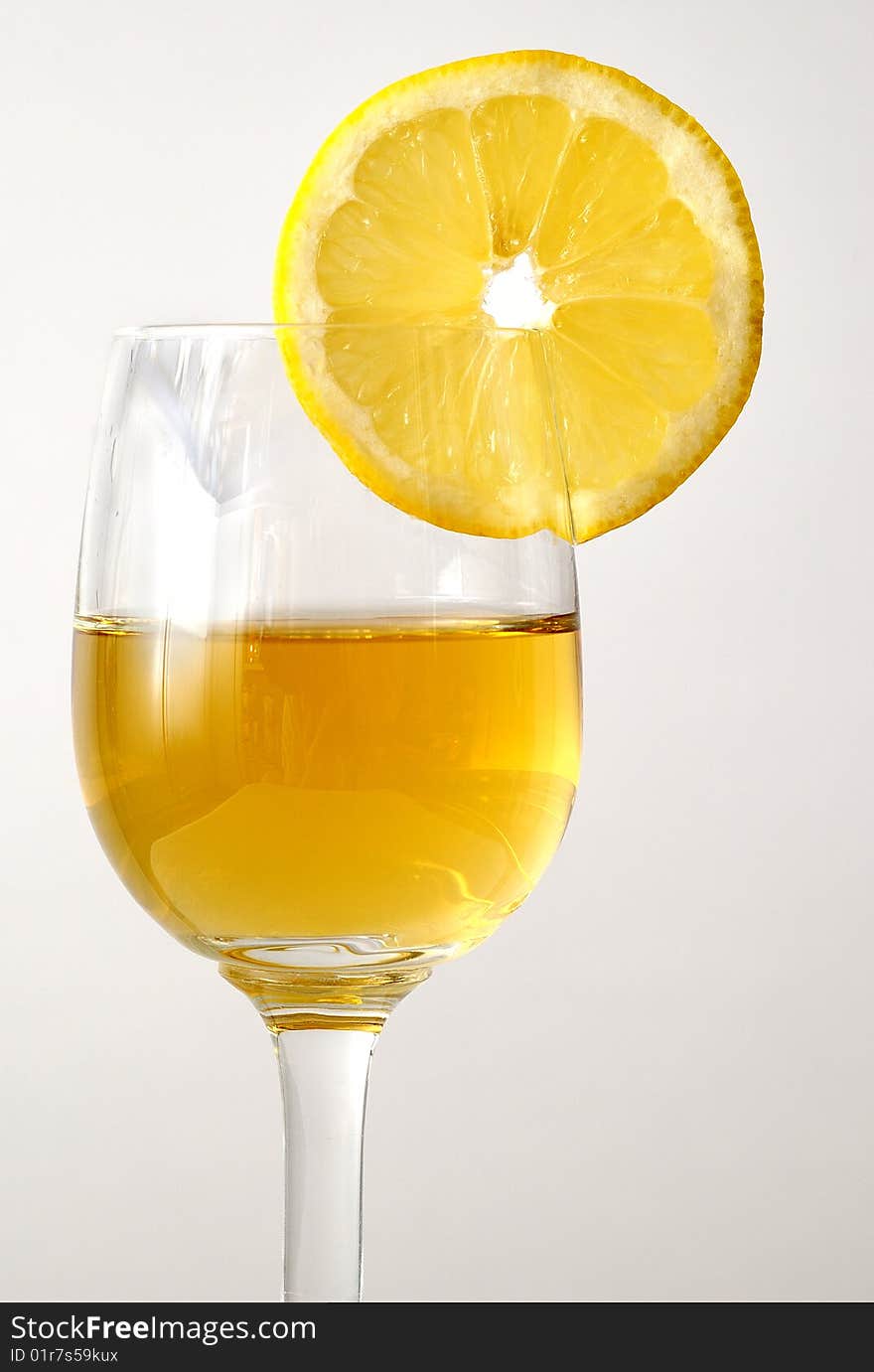 The drink in the glass with an orange