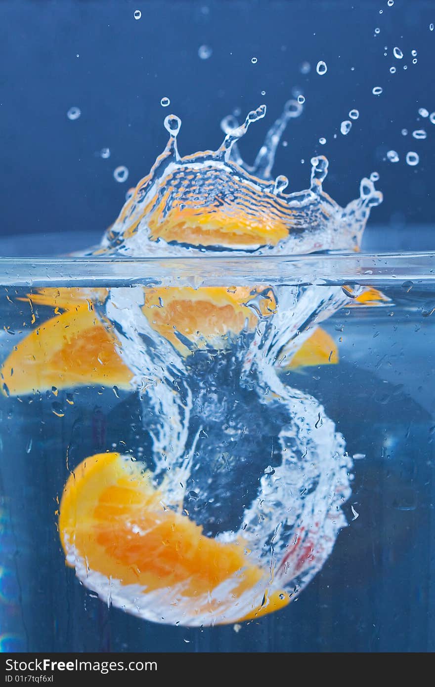 Lemon and orange splashing on fresh water. Lemon and orange splashing on fresh water