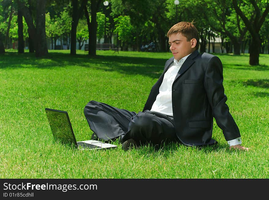 Young businessman in the park