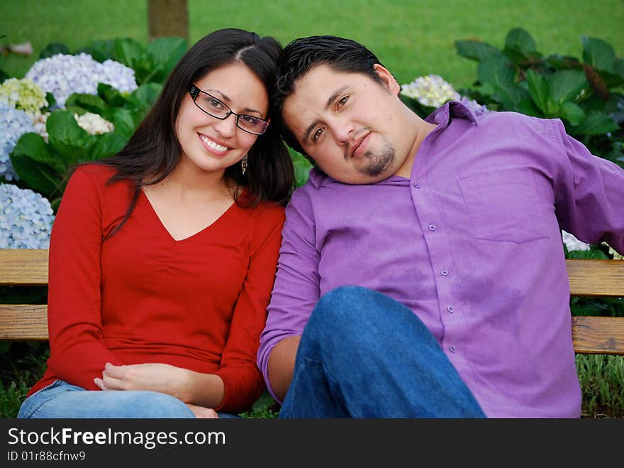 Beautiful Hispanic couple embracing in an outdoor setting. Beautiful Hispanic couple embracing in an outdoor setting