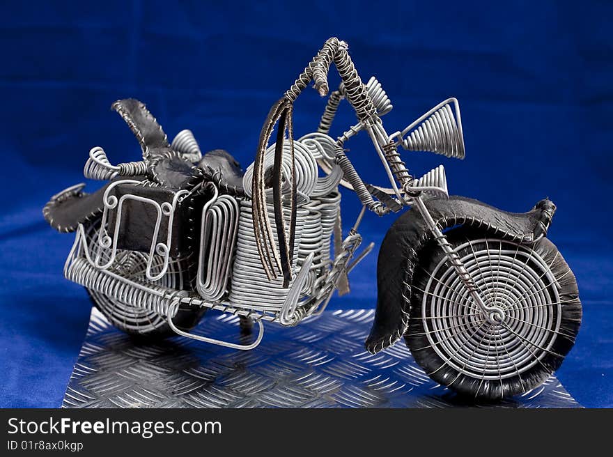 Wire frame easy rider chopper hand crafted on blue background. Wire frame easy rider chopper hand crafted on blue background