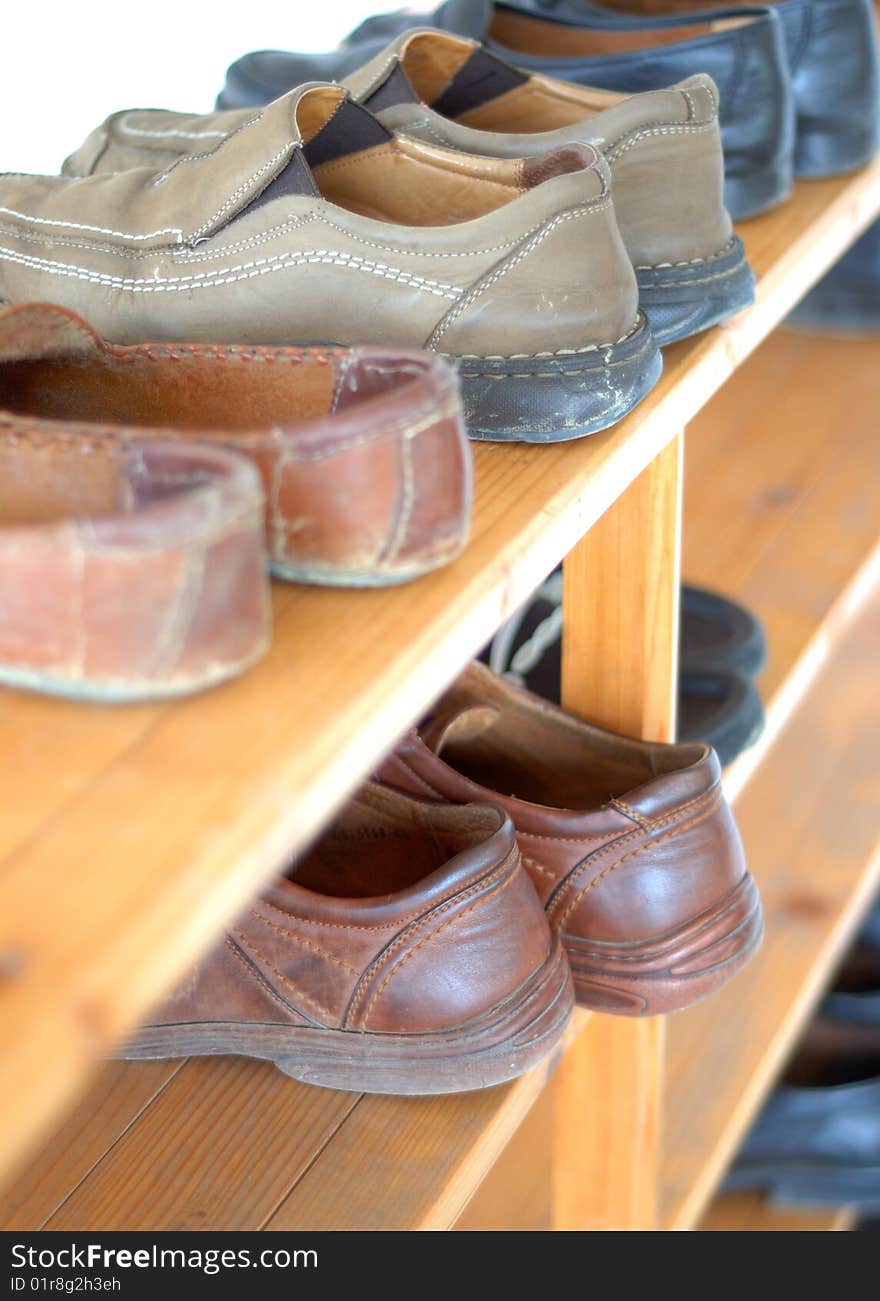 Man shoes arranged on the severeal shelfs. Man shoes arranged on the severeal shelfs