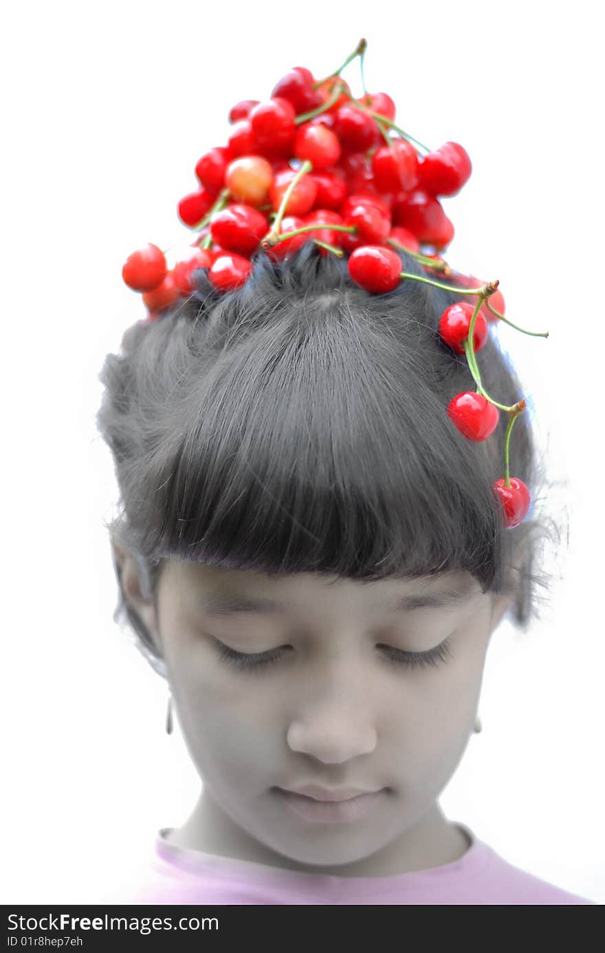 Little girl with cherry on her head. Little girl with cherry on her head