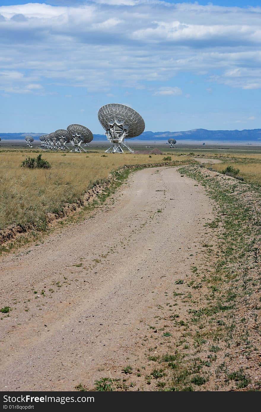 Very Large Array against blue clouded sky. Very Large Array against blue clouded sky.