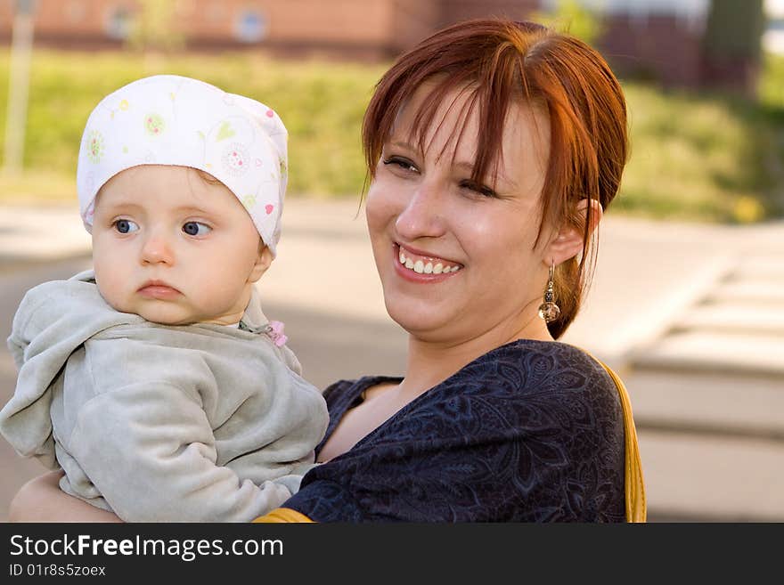 Mother and her baby in park. Mother and her baby in park