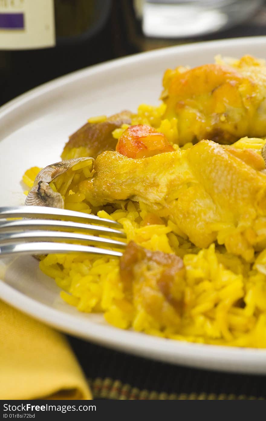 Delicious seafood paella and chicken rice yellow isolated