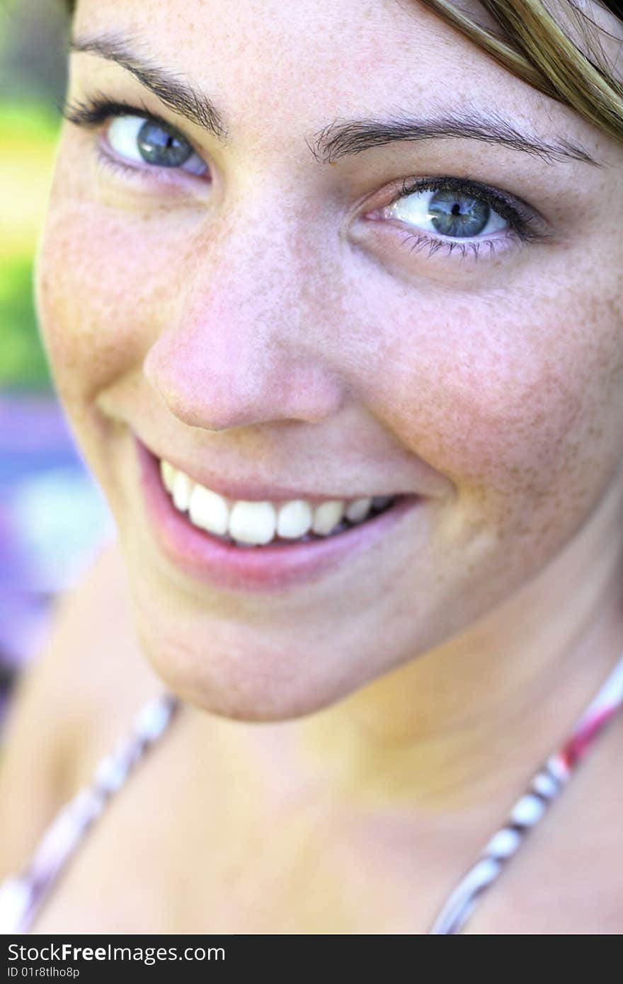 Young woman smiling at camera. Young woman smiling at camera