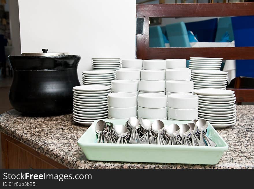 Stack of empty white plates on a table