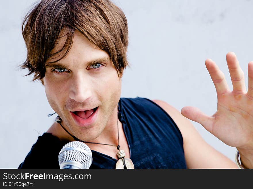 A Rock Star Jamming out with a microphone