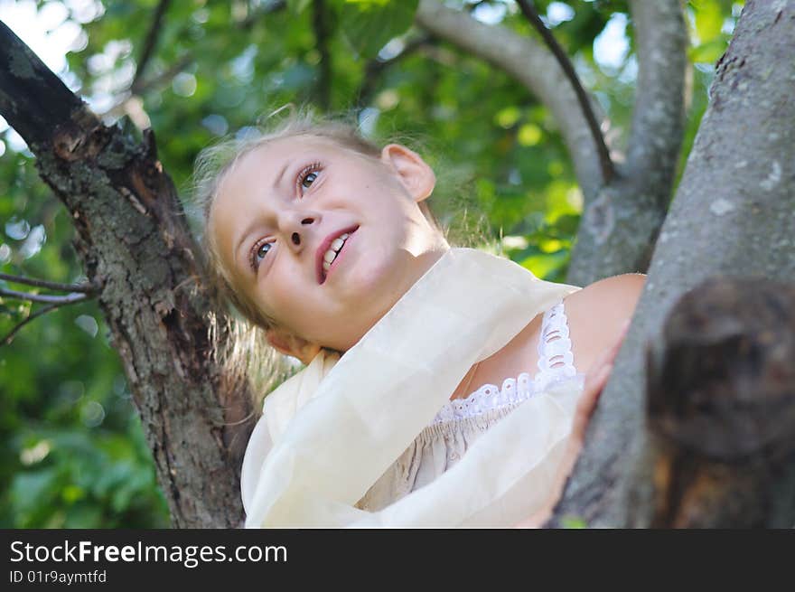 The cute girl among trees