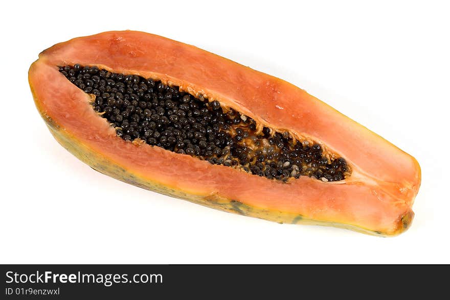 Papaya cut in front with view of seeds. Papaya cut in front with view of seeds