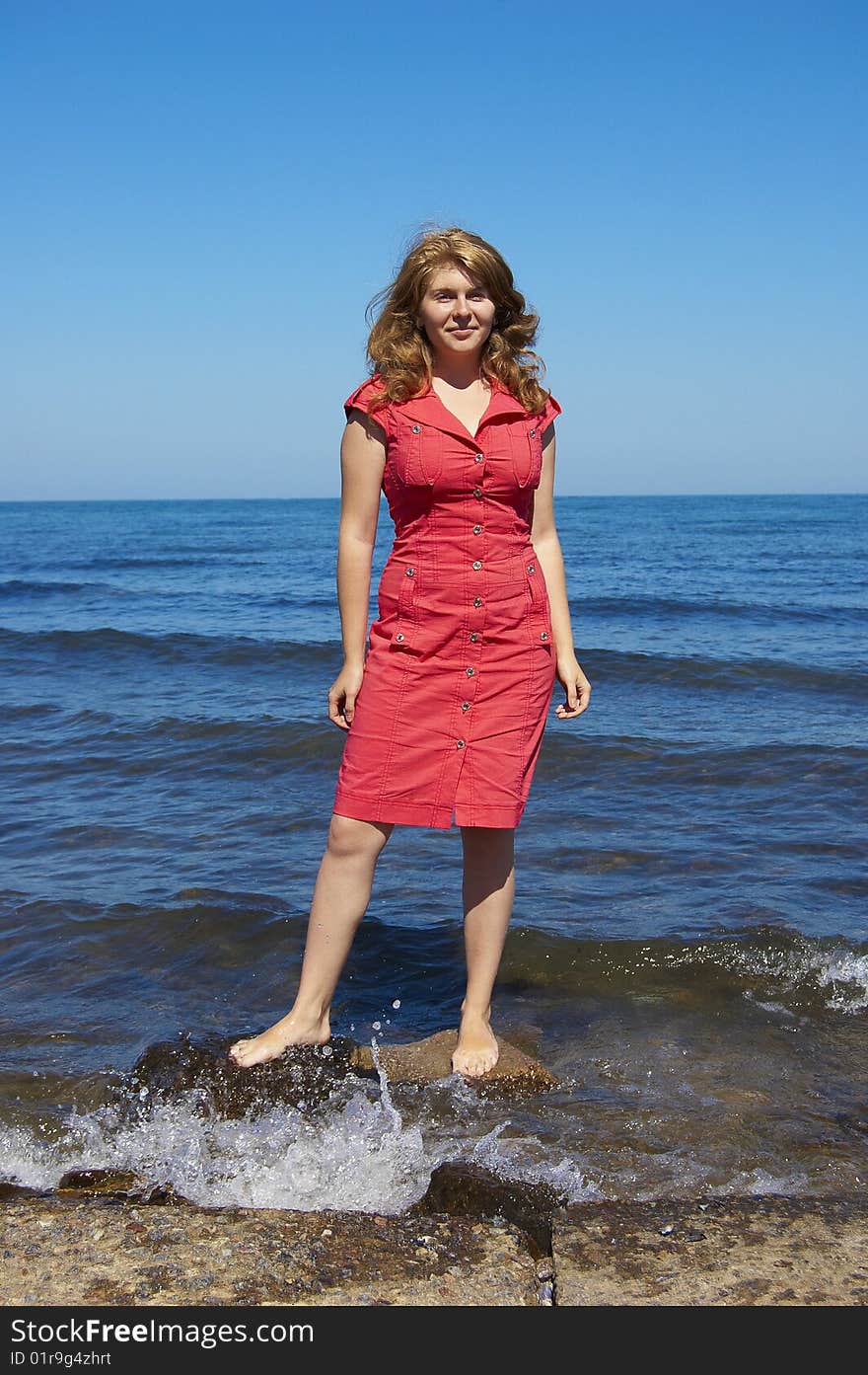 Woman on the sea beach. Woman on the sea beach