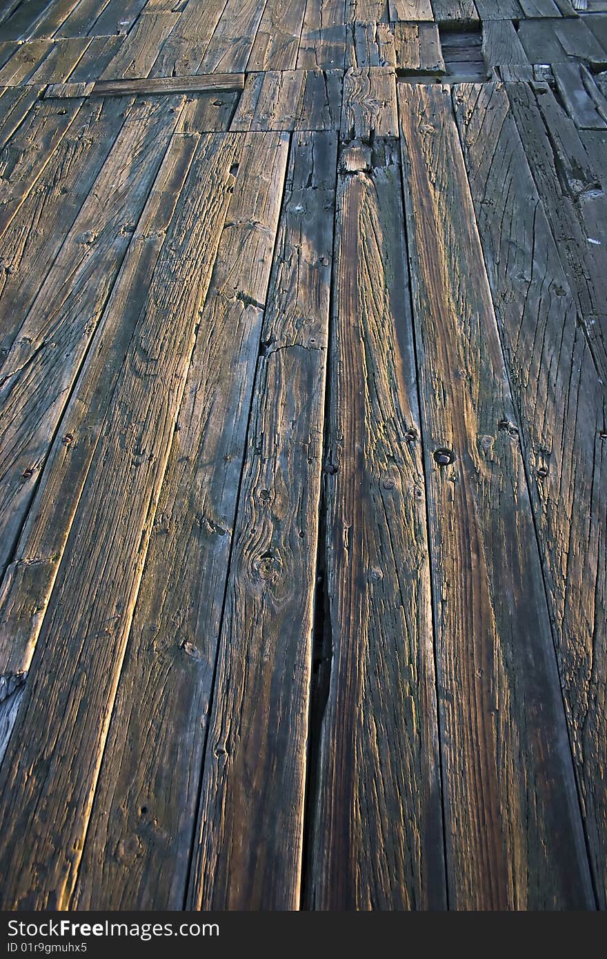 Close up of wooden planks of a jetty/quay. Close up of wooden planks of a jetty/quay