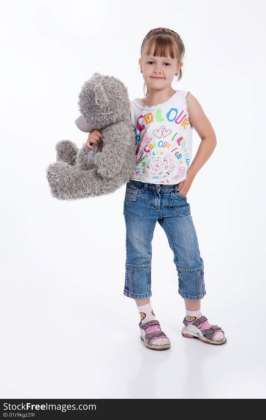 Little girl with a toy on white background. Little girl with a toy on white background