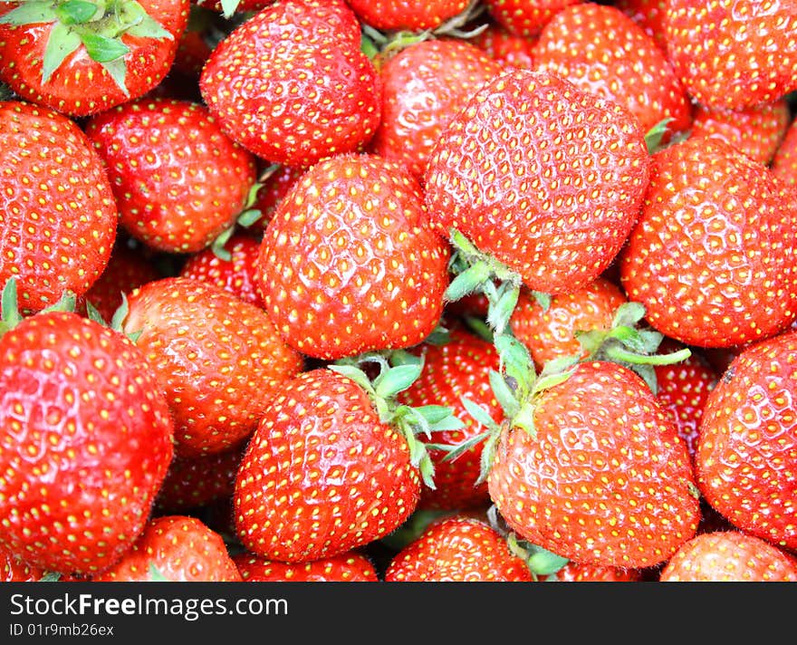 Fresh strawberries background. Color image