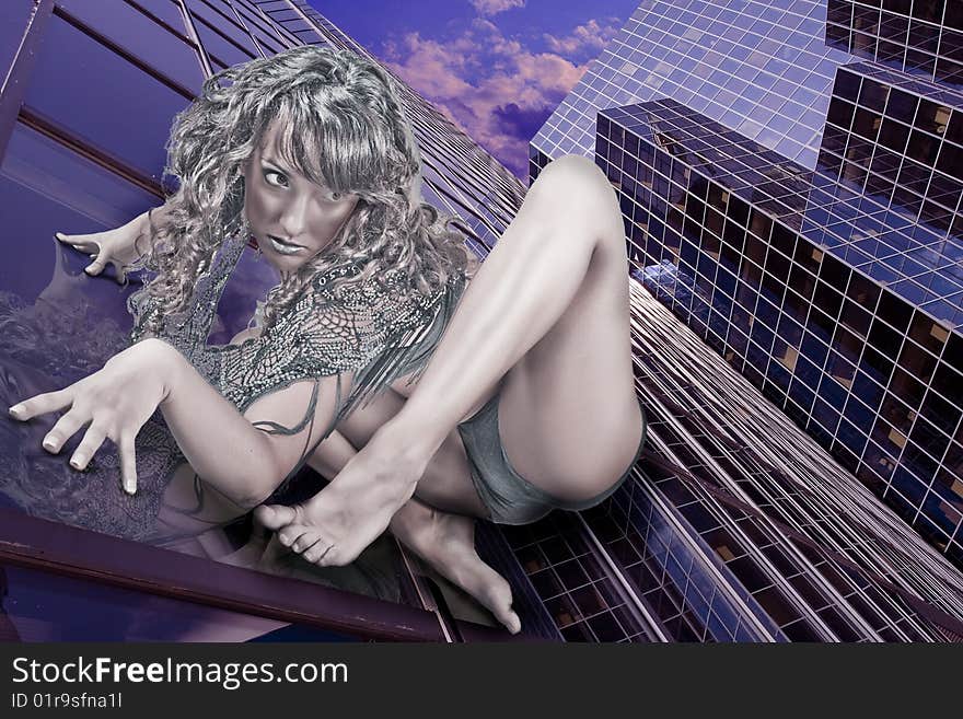 Beautiful woman as a spider women stikking on a glass building. Beautiful woman as a spider women stikking on a glass building