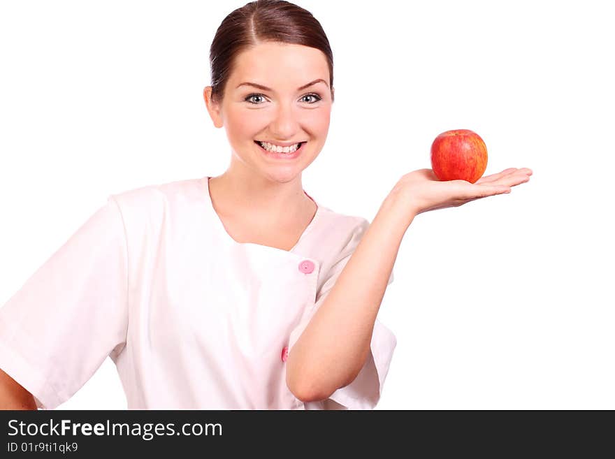 A nurse/dietican holding up an apple and smiling. A nurse/dietican holding up an apple and smiling.