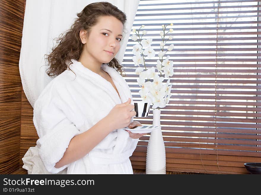 The beautiful girl holds a coffee cup