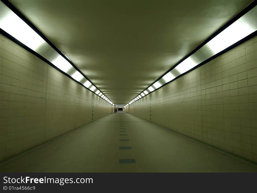 Evening empty subway below train station leading to the platforms. Evening empty subway below train station leading to the platforms.