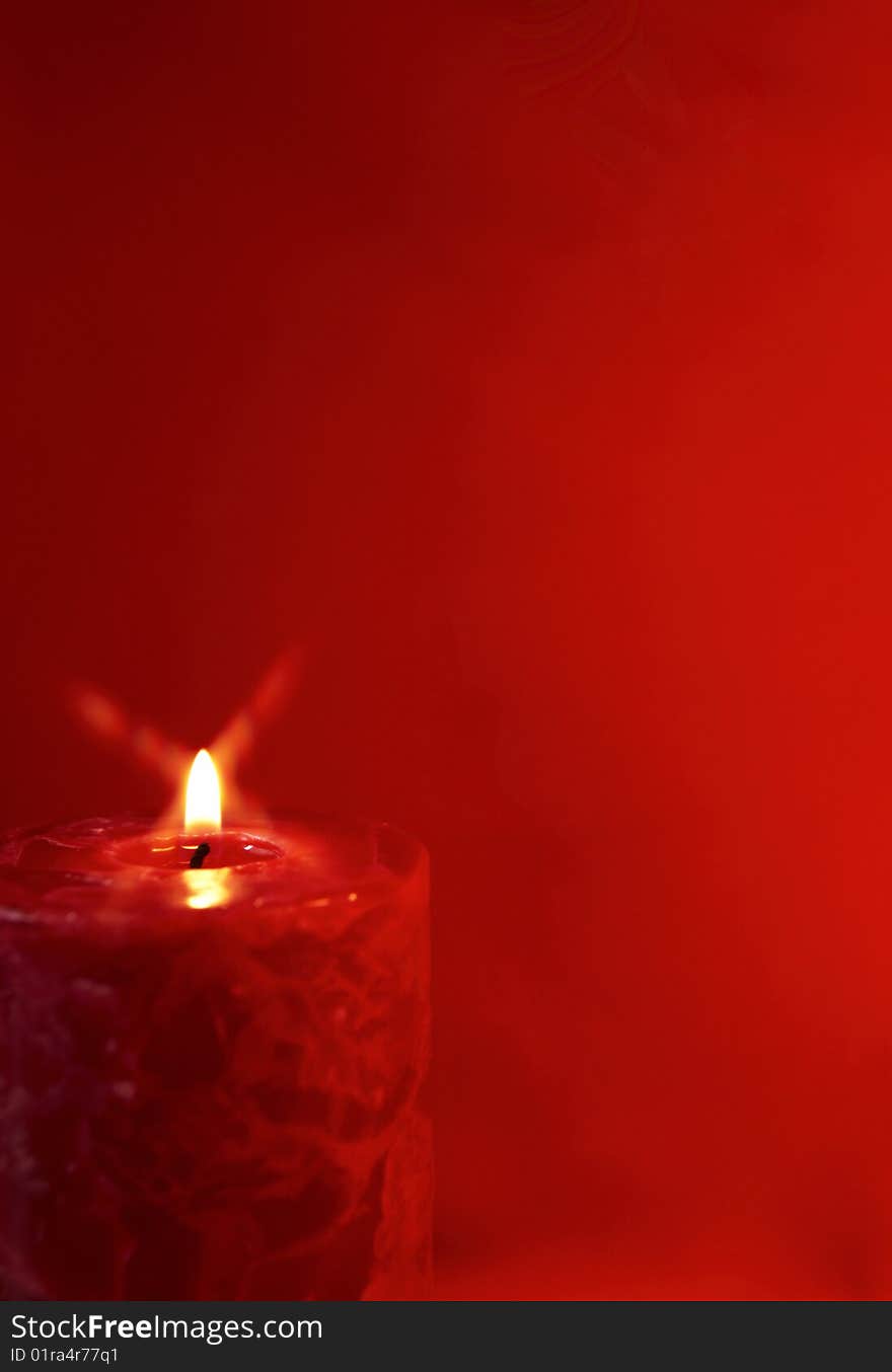 Red candles on a red background