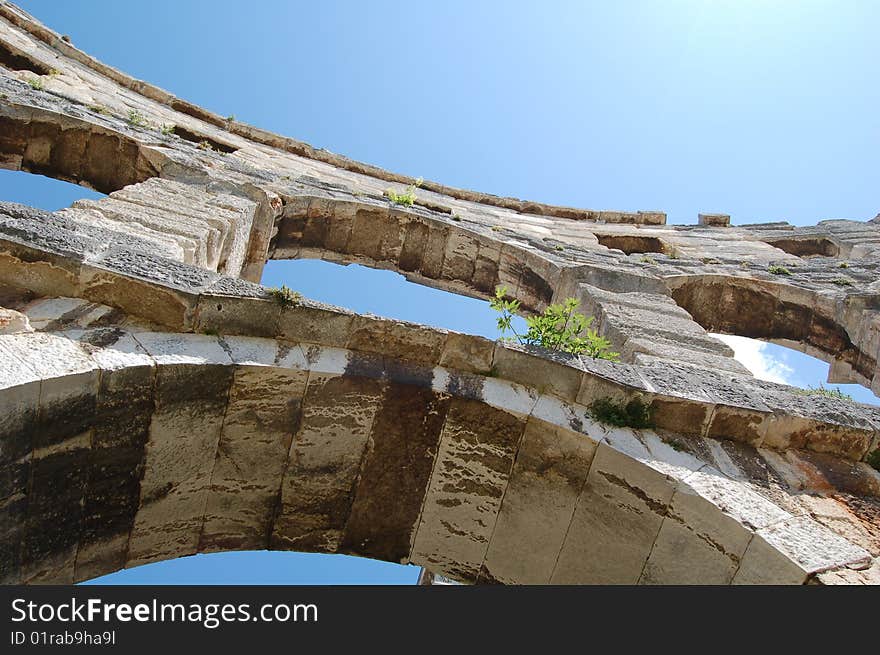 Arches of a Roman colosseum, in Pula, Croatia. Arches of a Roman colosseum, in Pula, Croatia.