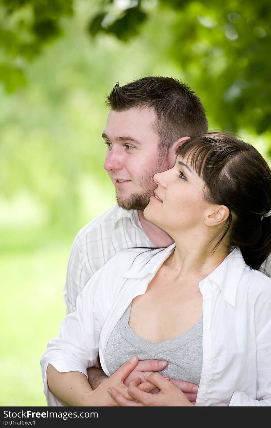 Happy young couple relaxing in park. Happy young couple relaxing in park