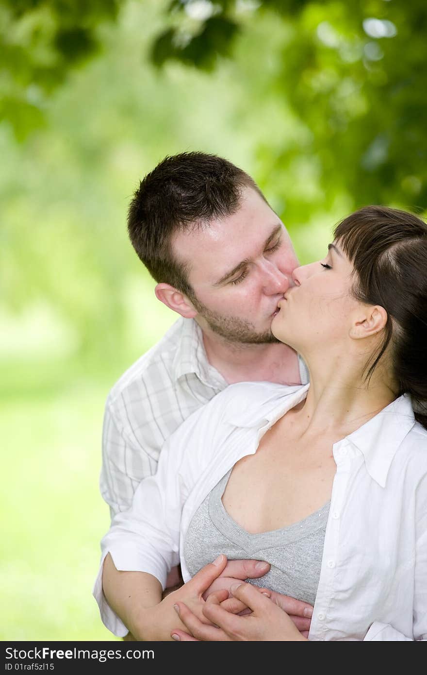 Happy young couple relaxing in park. Happy young couple relaxing in park