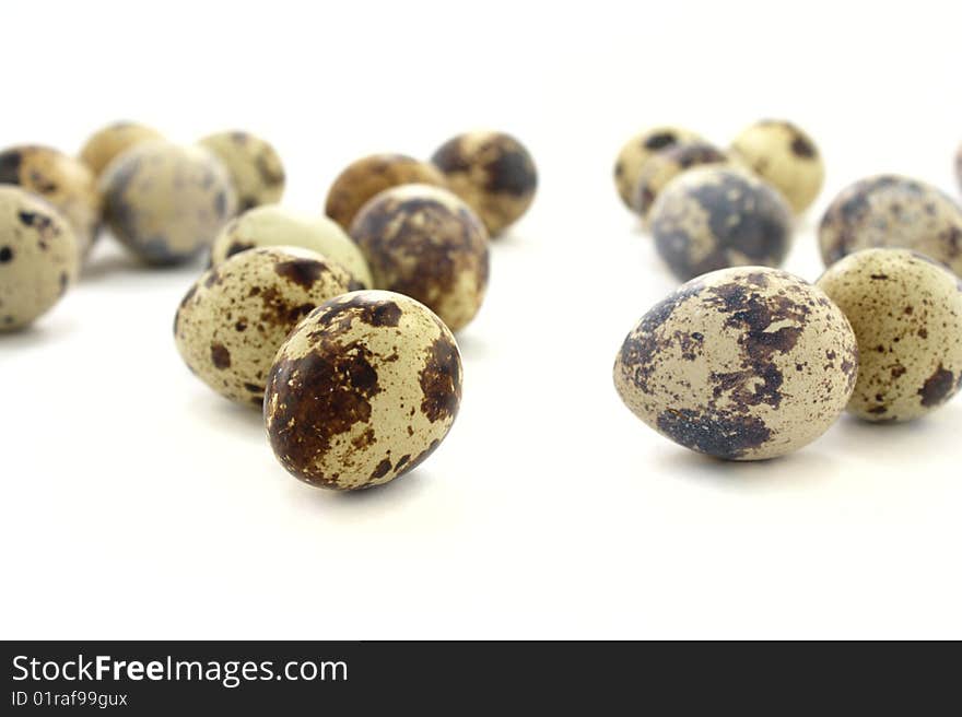 Quail eggs isolated on white