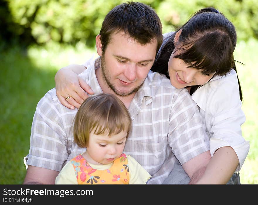 Mother, father and daughter together in park. Mother, father and daughter together in park