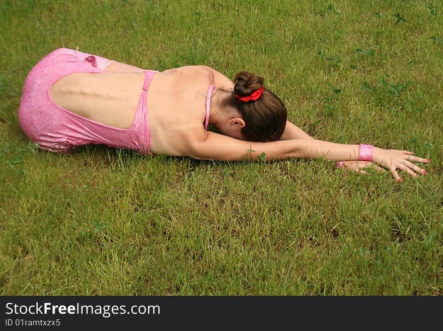 Girl lying on grass in a park