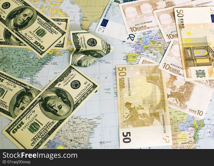 Denominations of Dollars fly in Euro on a world card. Denominations of Dollars fly in Euro on a world card