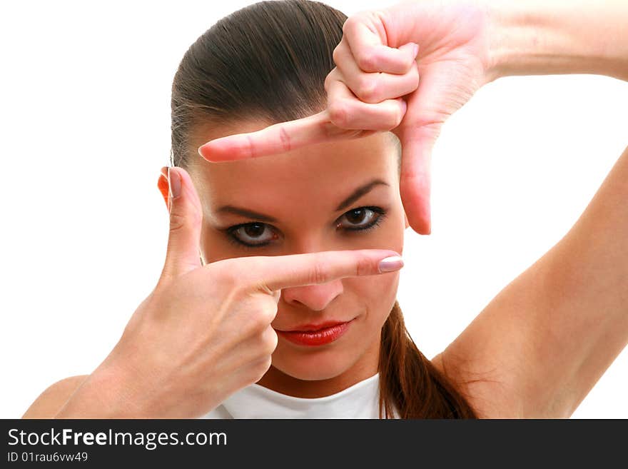 Closeup of beautiful woman making frame with her hands