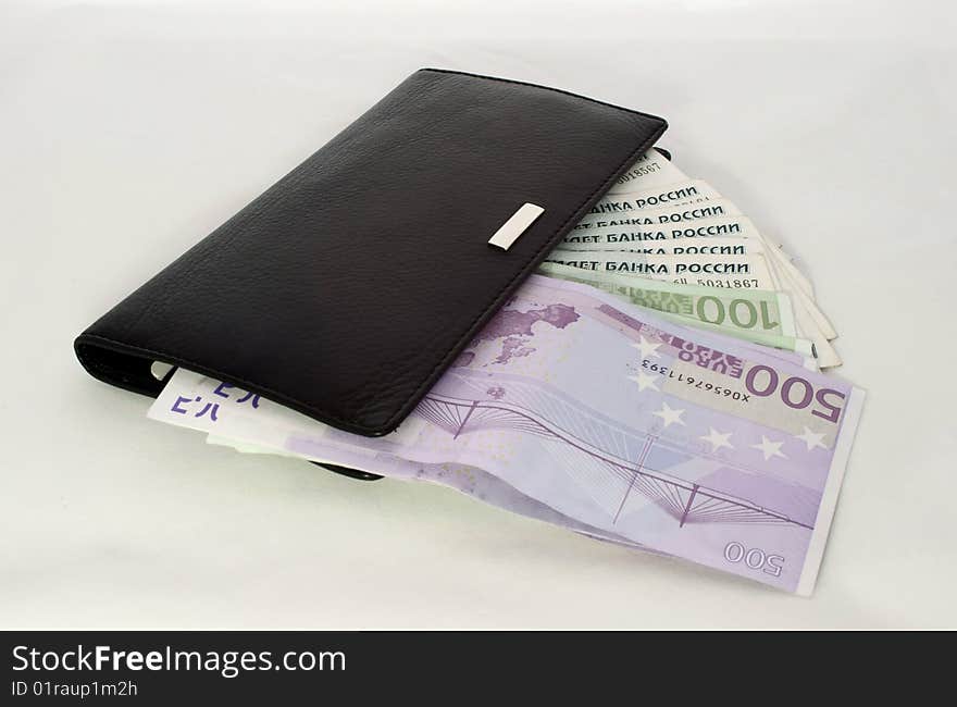 Locked wallet with money - a rouble and euro